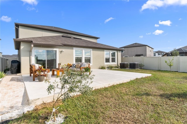 rear view of property with central air condition unit, a yard, a patio, and an outdoor hangout area