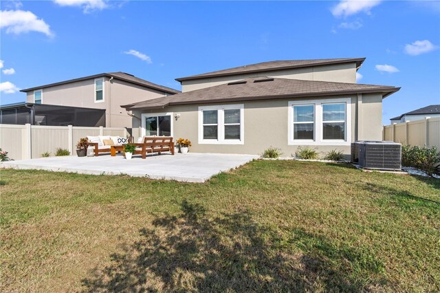 8968 Parsons Hill Blvd, Wesley Chapel, FL 33545 - back of house with roof with shingles, stucco siding, a patio, and central AC