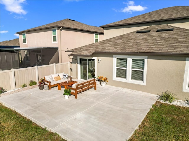 back of property featuring outdoor lounge area and a patio area