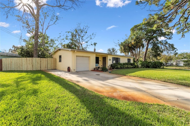 single story home featuring a garage and a front lawn