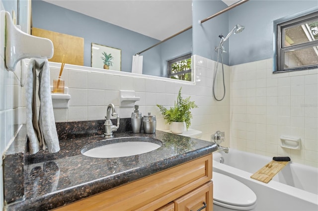 full bathroom featuring tile walls, vanity, shower / bath combo, toilet, and decorative backsplash