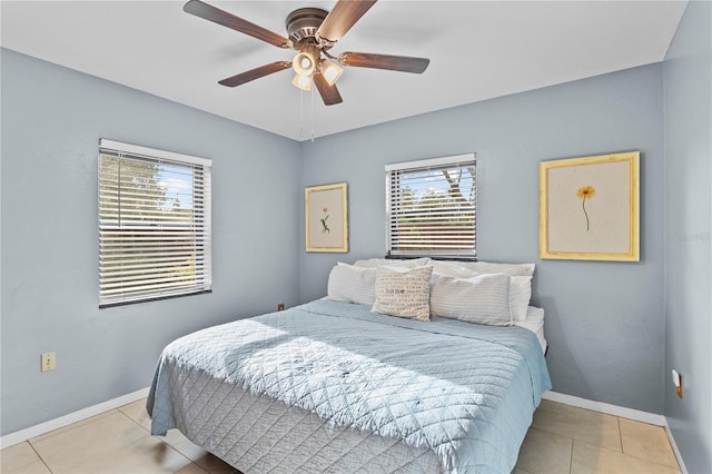 tiled bedroom with ceiling fan