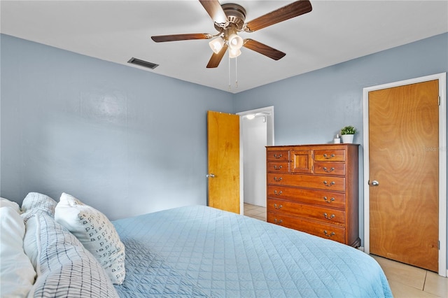 bedroom featuring ceiling fan and light tile patterned flooring