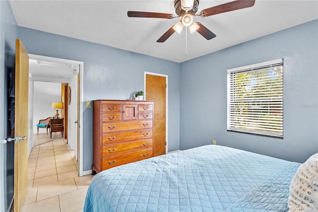 tiled bedroom with ceiling fan