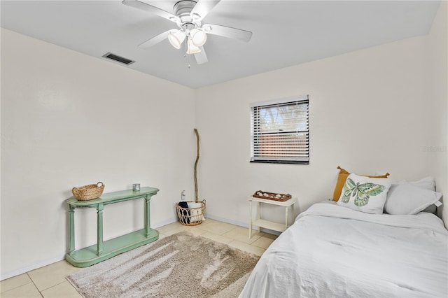 bedroom featuring ceiling fan and light tile patterned floors