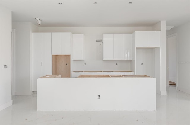 kitchen featuring white cabinets and a kitchen island