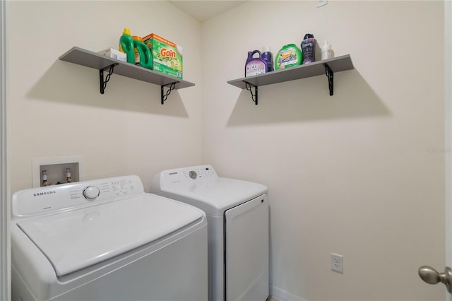 clothes washing area featuring washing machine and dryer