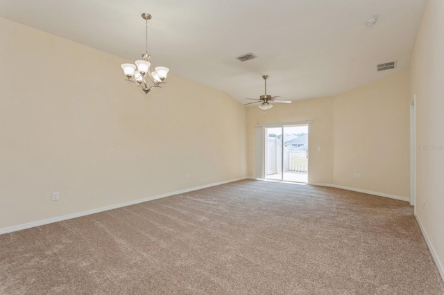 spare room featuring ceiling fan with notable chandelier, lofted ceiling, and light carpet