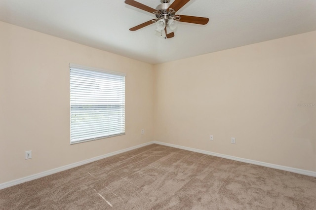 carpeted empty room with ceiling fan