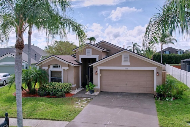 view of front of house featuring a garage and a front yard