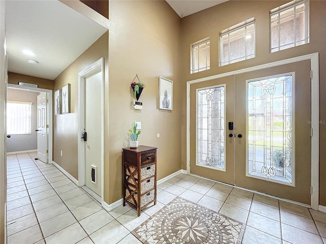 tiled foyer featuring french doors