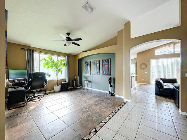 tiled office with ceiling fan and lofted ceiling