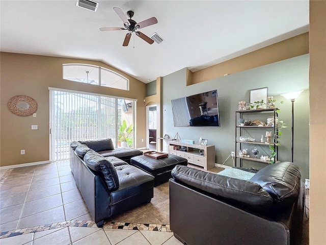 tiled living room featuring ceiling fan and vaulted ceiling