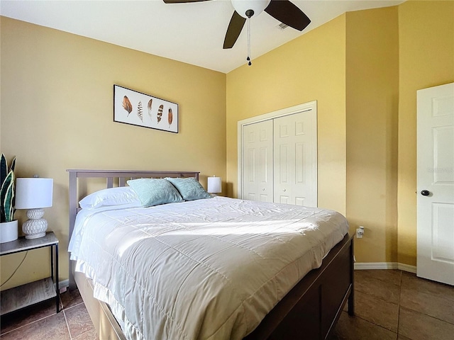 tiled bedroom featuring a closet and ceiling fan