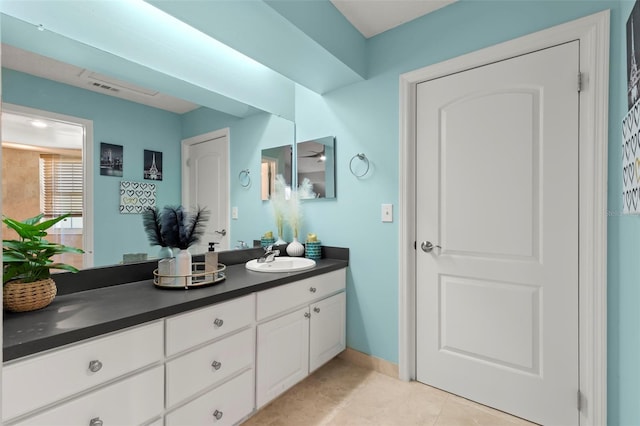 bathroom with tile patterned flooring and vanity