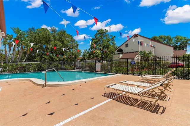 view of swimming pool featuring a patio area