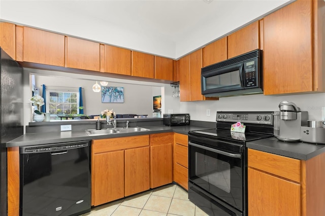 kitchen with black appliances, light tile patterned floors, and sink