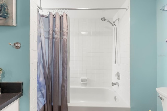 bathroom with toilet and shower / tub combo