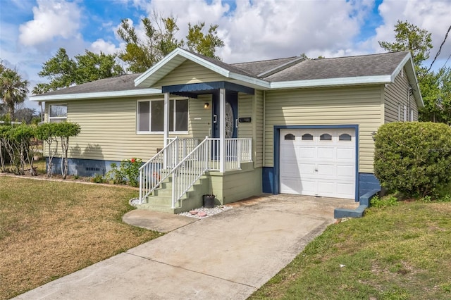 single story home with a garage and a front lawn