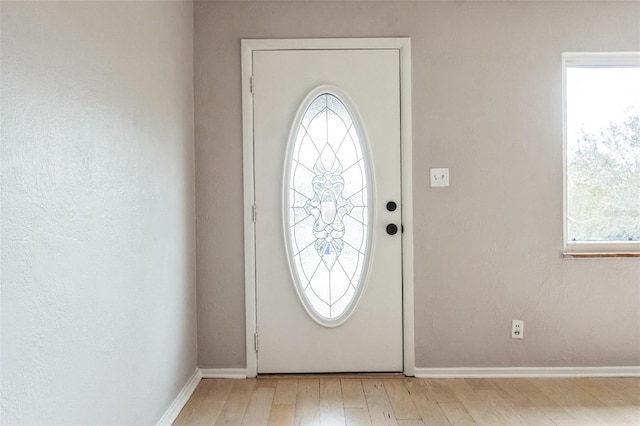 entryway with light hardwood / wood-style flooring