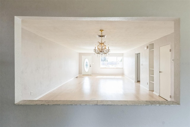 interior space featuring an inviting chandelier