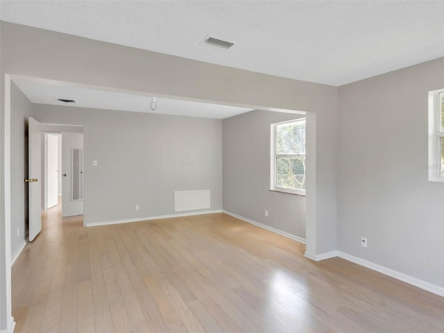 unfurnished room featuring light wood-type flooring