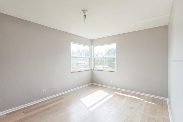 unfurnished room with light hardwood / wood-style flooring