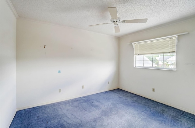 carpeted empty room with a textured ceiling, ornamental molding, and ceiling fan