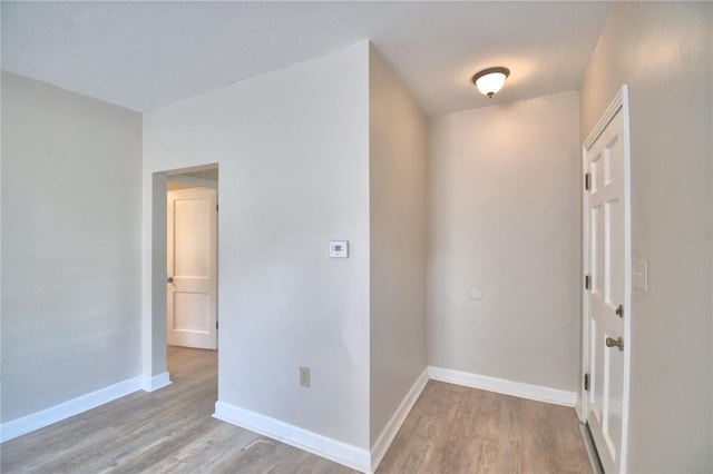 hallway with light wood-type flooring