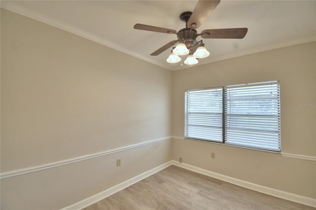 unfurnished room with ceiling fan, light hardwood / wood-style floors, and ornamental molding