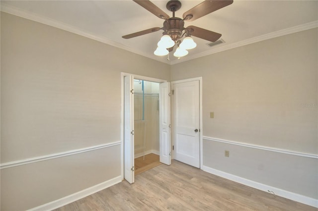 unfurnished bedroom featuring ceiling fan, a closet, crown molding, and light hardwood / wood-style flooring