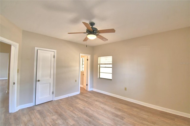 unfurnished bedroom featuring ceiling fan and light hardwood / wood-style floors