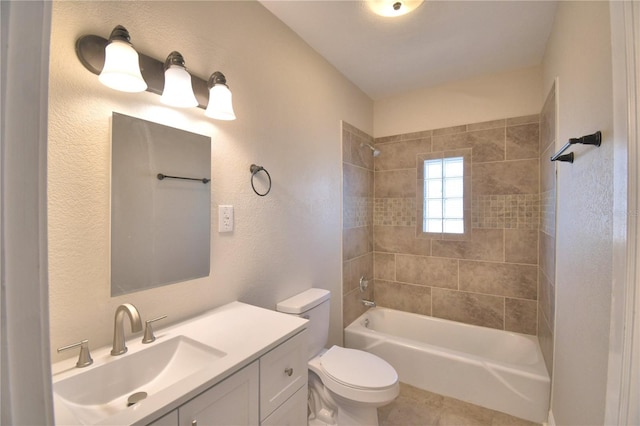 full bathroom with tiled shower / bath combo, toilet, and vanity