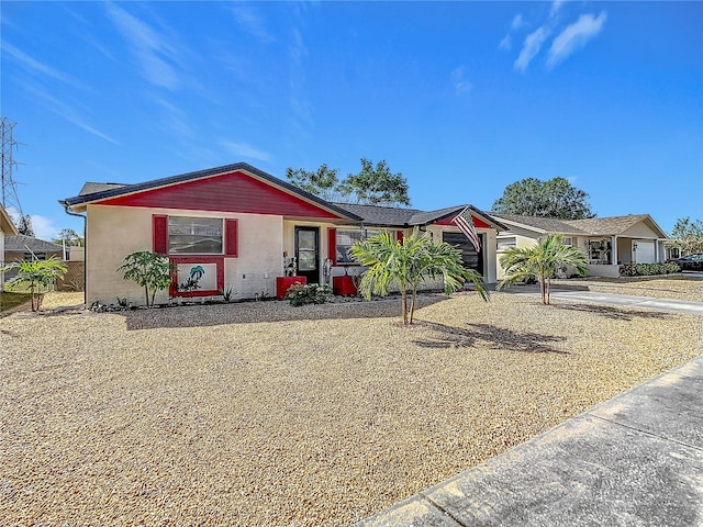 ranch-style house featuring a garage