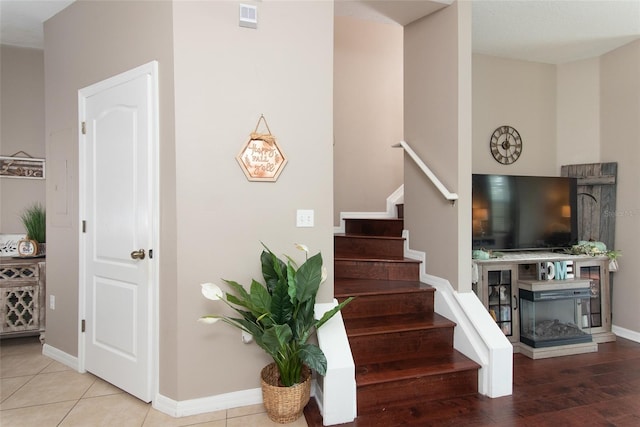 staircase featuring hardwood / wood-style flooring