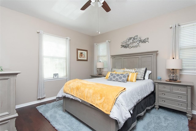 bedroom with ceiling fan and dark hardwood / wood-style floors