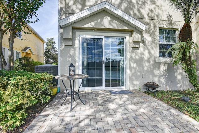 doorway to property with a patio