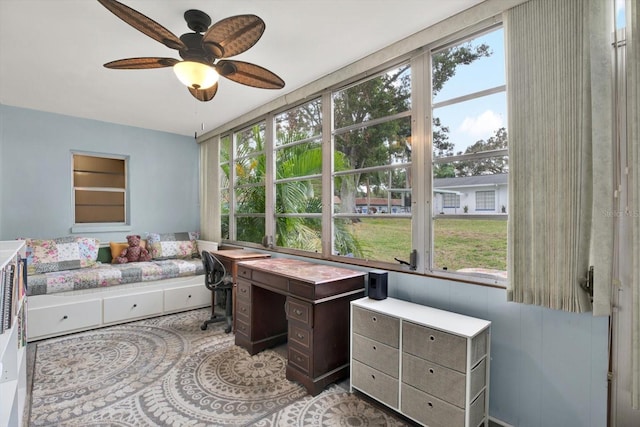 bedroom featuring multiple windows and ceiling fan