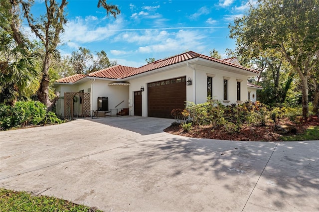 mediterranean / spanish-style house featuring a garage