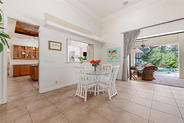 tiled dining room with ornamental molding