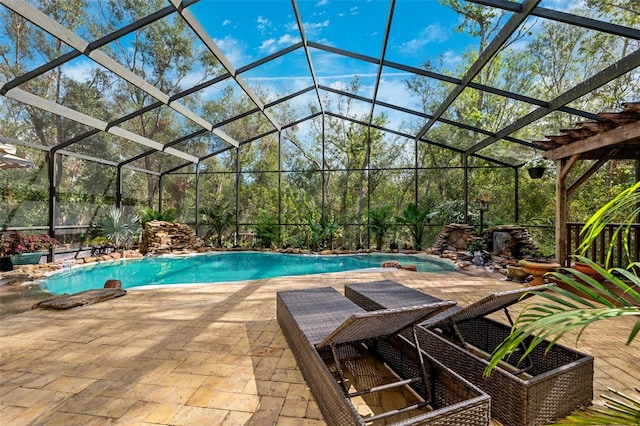 view of swimming pool featuring glass enclosure and a patio area