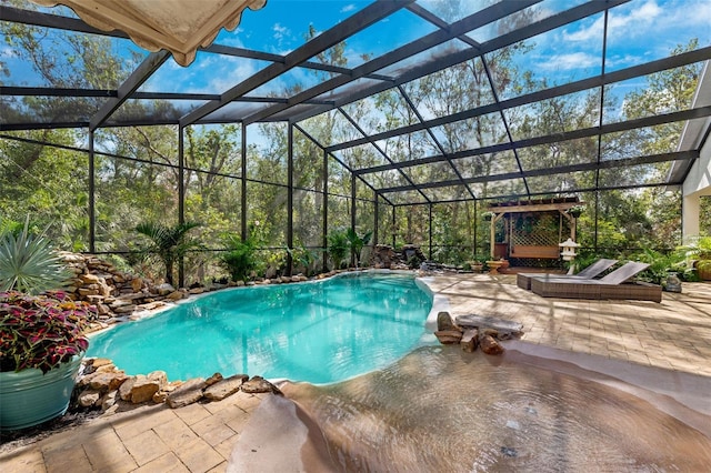 view of pool featuring a lanai and a patio area