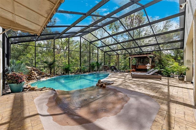 view of swimming pool featuring glass enclosure and a patio