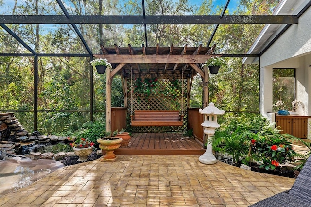 view of patio / terrace featuring glass enclosure