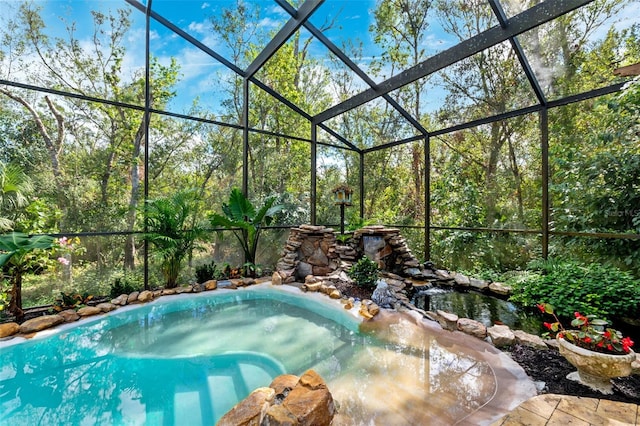 view of pool featuring a lanai