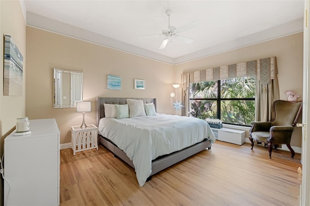 bedroom with light wood-type flooring and ceiling fan