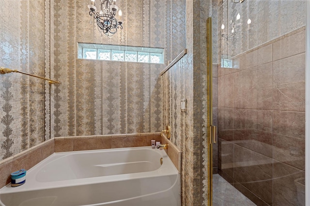 bathroom with separate shower and tub