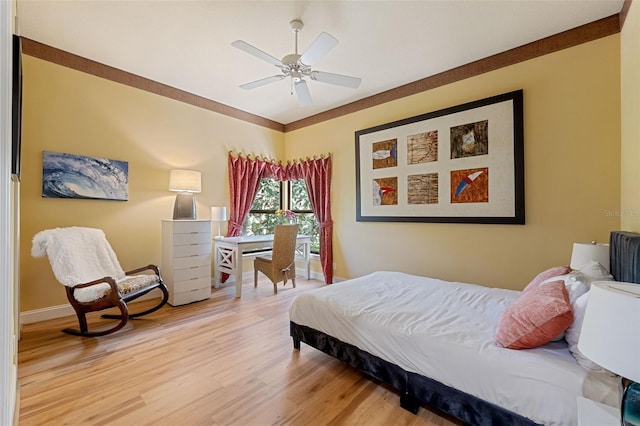 bedroom with ceiling fan and wood-type flooring