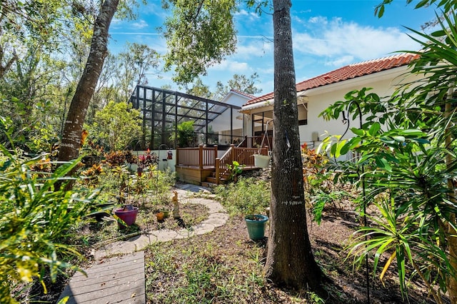 view of yard featuring a wooden deck