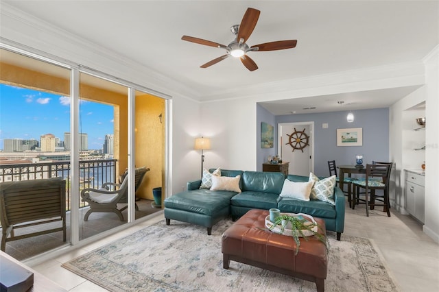 tiled living room featuring ceiling fan and crown molding